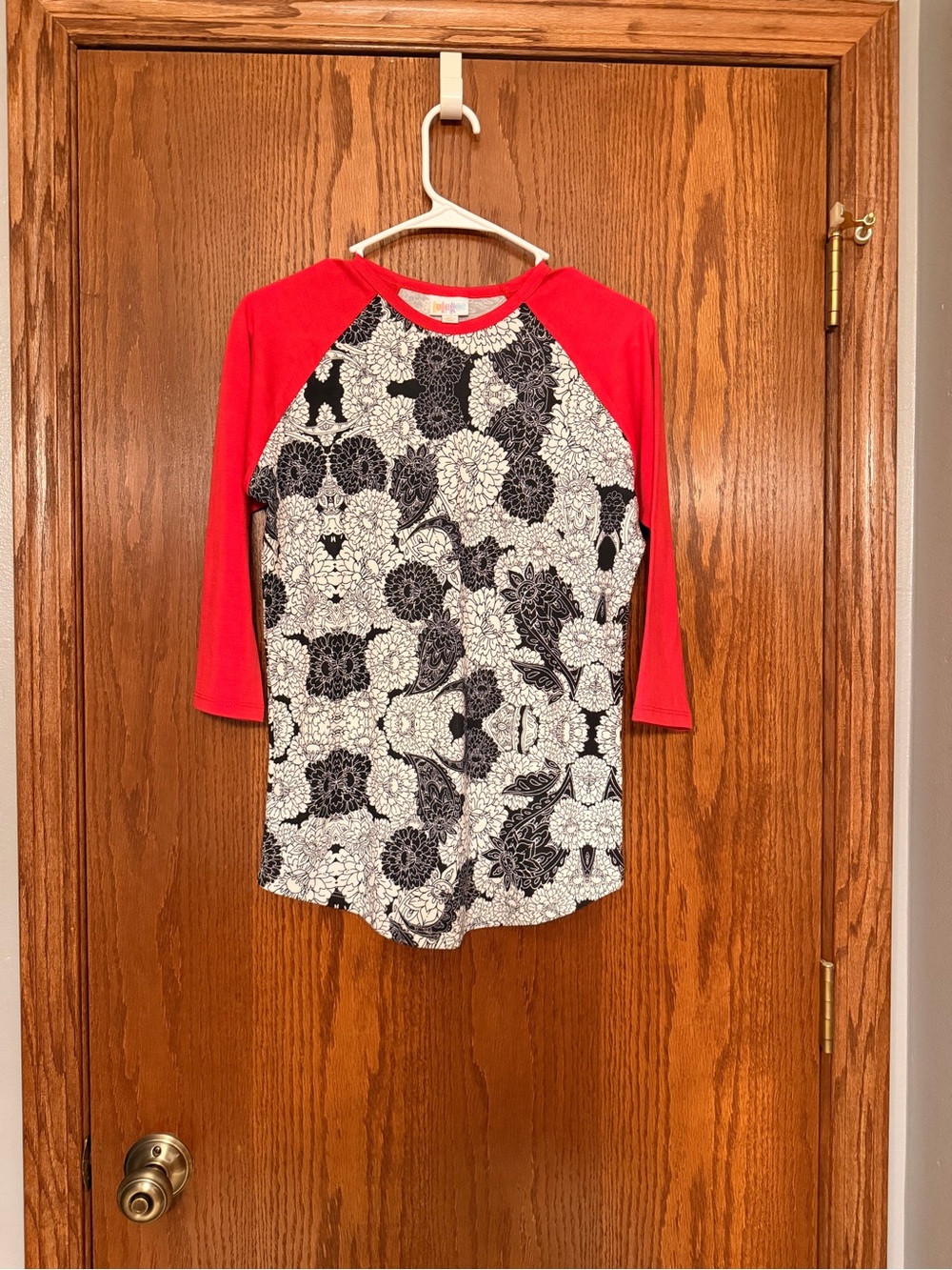 LuLaRoe Black & White Floral Raglan Tee with Red Sleeves